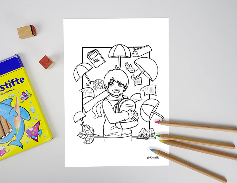 Eine Malvorlage auf einem Tisch zeigt ein lächelndes Kind mit einem Rucksack, umgeben von schwebenden Büchern, Buchstaben, Blättern und Regenschirmen. In der Nähe befinden sich Buntstifte und eine Schachtel mit Buntstiften.